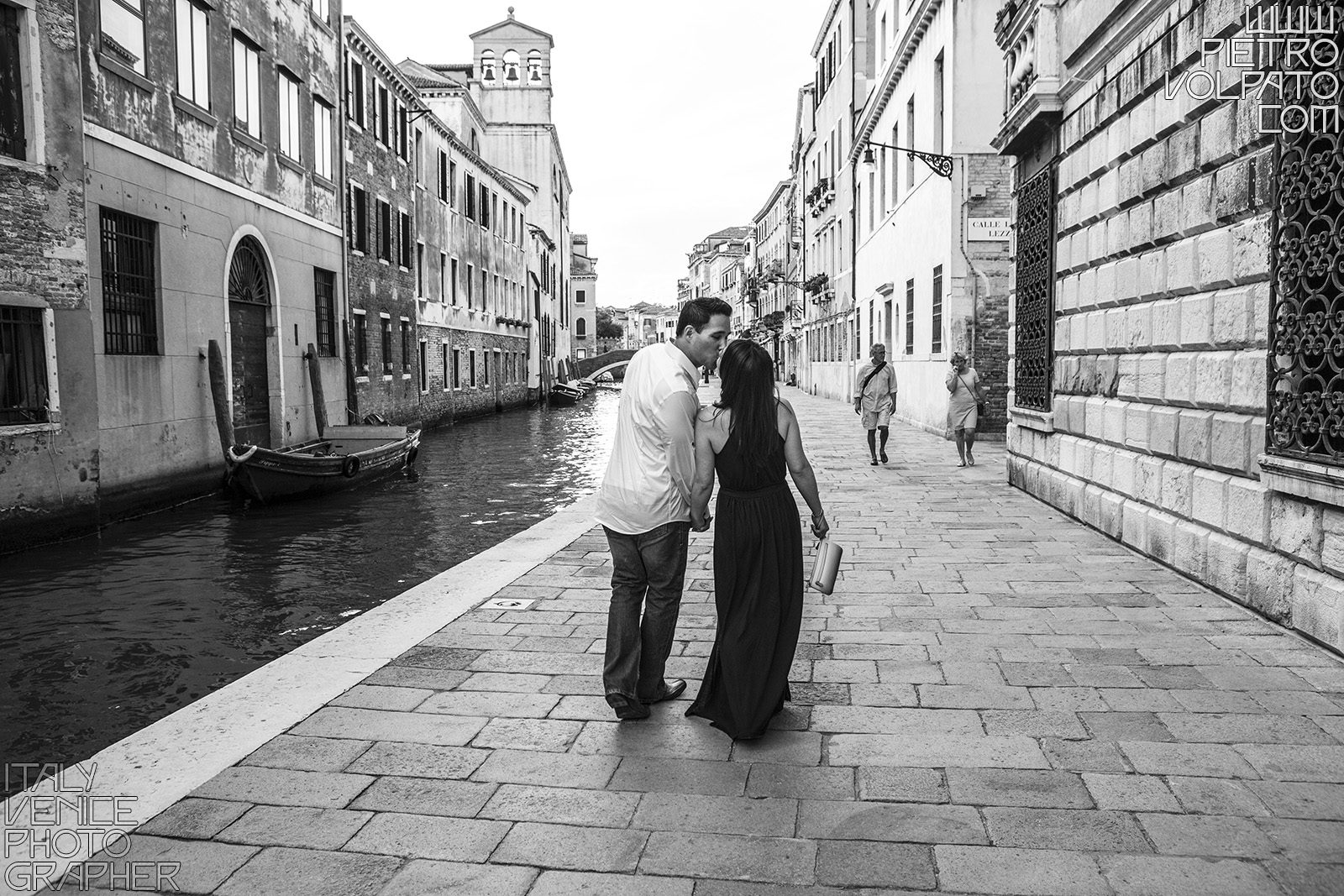 Photographer in Venice Italy for a vacation photo shoot during a walking tour and gondola ride - romantic and fun couple photo walk in Venice