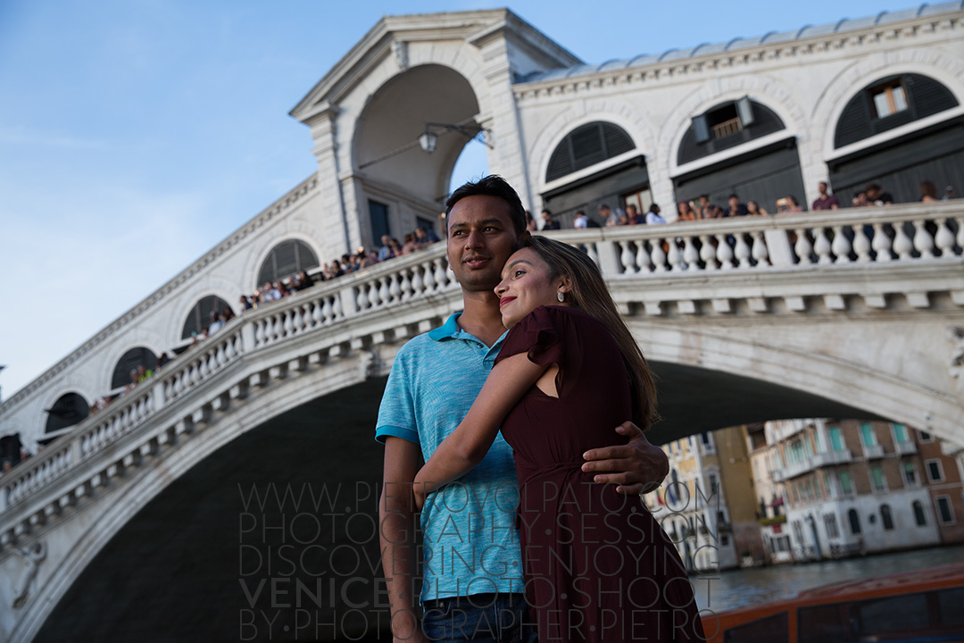 Venice photographer for a vacation photo shoot and tour. Romantic and fun photos of a couple in Venice during a photo walk and gondola ride.