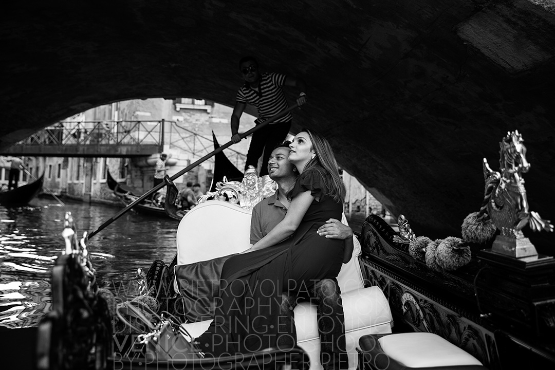 Venice photographer for a vacation photo shoot and tour. Romantic and fun photos of a couple in Venice during a photo walk and gondola ride.