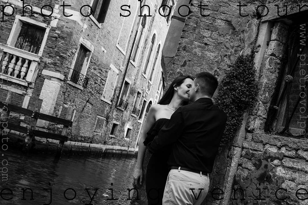 A couple enjoys a romantic moment on the banks of a canal in Venice. This photo was taken early in the morning in Venice by local photographer Pietro Volpato.